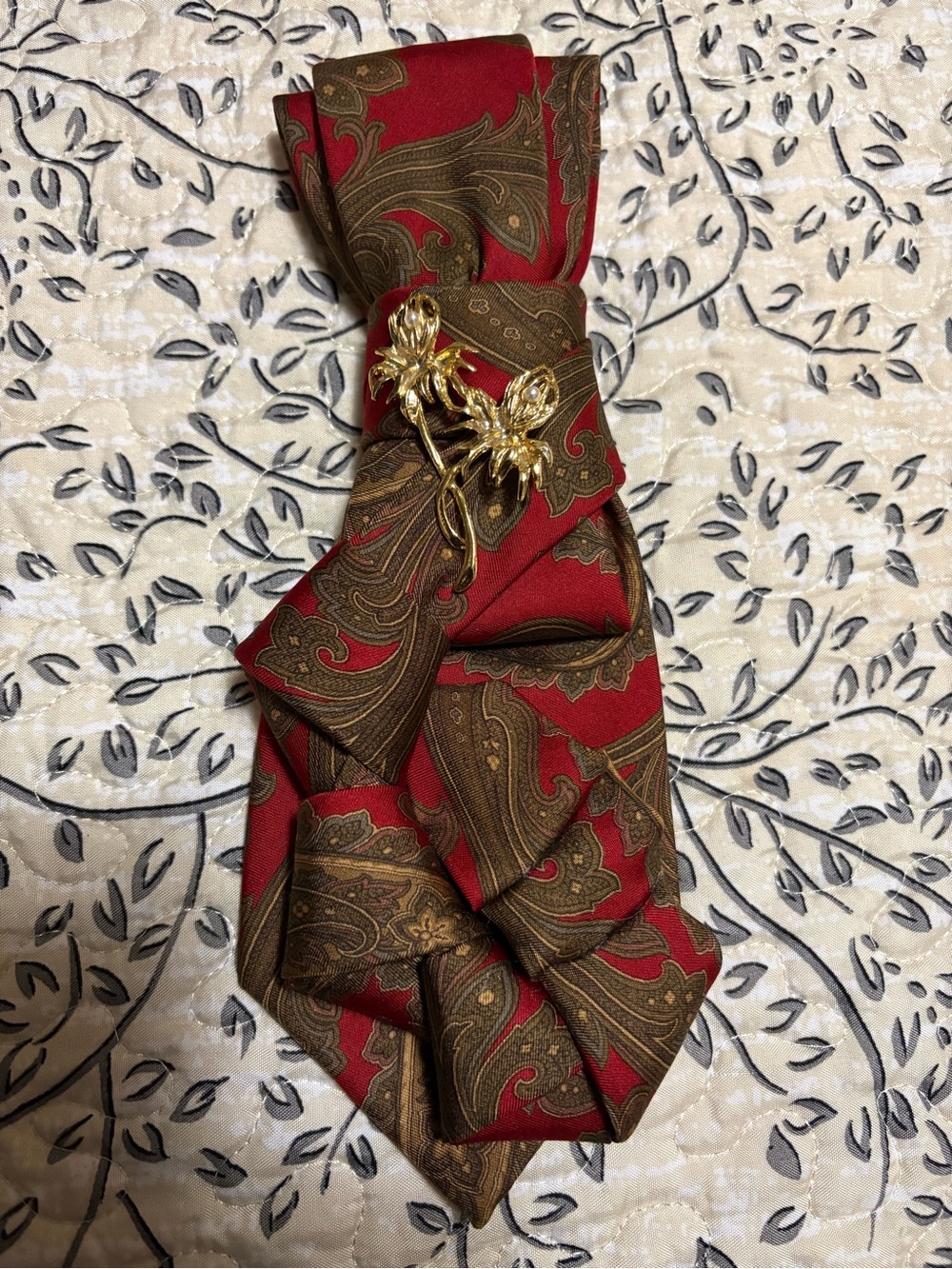 Red and Brown Paisley female necktie with Gold Floral Brooch